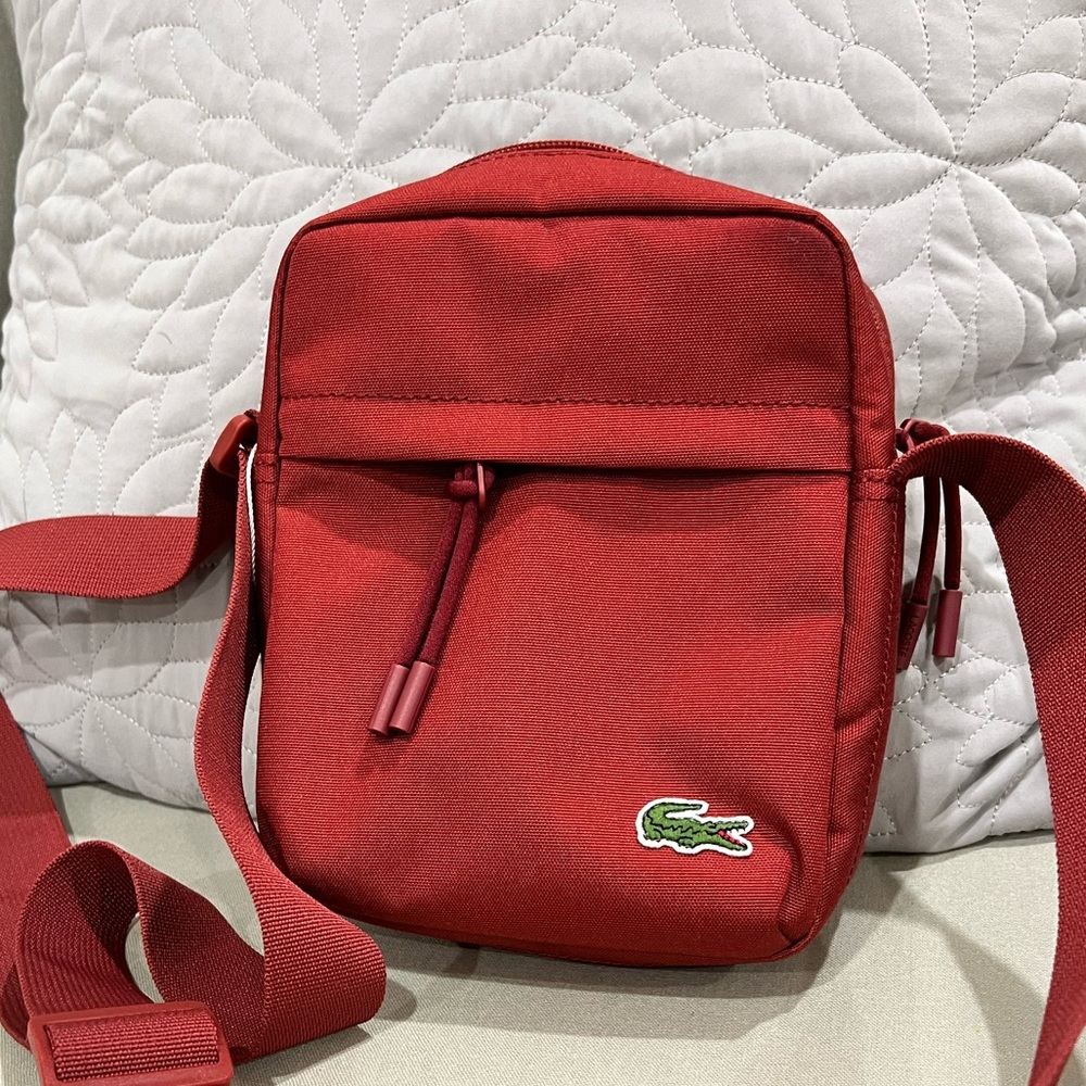 Brand new lactose messenger bag in deep red